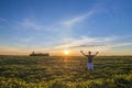 Young man standing near bicycle in morning sunrise with wonderf Royalty Free Stock Photo