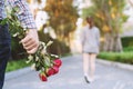 Young man standing with a Red Rose on Hand Sadness Love in Ending Break up of Relationship Royalty Free Stock Photo