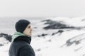 Young man looking to the horizon in a cold winter day Royalty Free Stock Photo