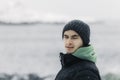 Young man looking to the horizon in a cold winter day Royalty Free Stock Photo