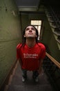 Young man standing on stairway