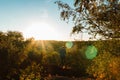 Young man standing on stone and looking to Czech ore mountain valley at sunset landscape Royalty Free Stock Photo