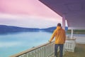 The young man standing on the terrace and looking at the sea Royalty Free Stock Photo