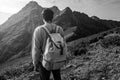 Young man standing on top of cliff mountains Royalty Free Stock Photo