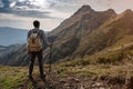 Young man standing on top of cliff mountains Royalty Free Stock Photo