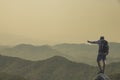 Young man standing on top of the mountain Royalty Free Stock Photo