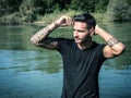 Young man standing in water in sea or lake Royalty Free Stock Photo