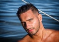 Young man standing in water in sea or lake Royalty Free Stock Photo