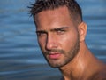 Young man standing in water in sea or lake Royalty Free Stock Photo