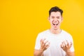 Young man standing wearing white t-shirt he expressions irate, angry face