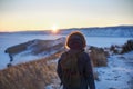 Young man standing in winter frozen nature. Ogoy island, lake Baikal, Siberia, Russia Royalty Free Stock Photo