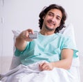 Young man staying in hospital in transfusion concept