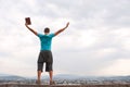 Young man staying with raised hands Royalty Free Stock Photo