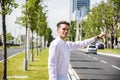 Young man stopping a taxi cab Royalty Free Stock Photo