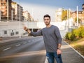 Young man stopping a taxi cab Royalty Free Stock Photo