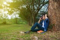 Young man in stress situation when talking on mobile phone in pa