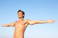 Young man stretching on beach Royalty Free Stock Photo