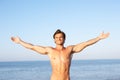 Young man stretching on beach Royalty Free Stock Photo