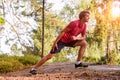 Young man stretching before jogging Royalty Free Stock Photo