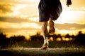 Young man strong legs off trail running at amazing summer sunset in sport and healthy lifestyle Royalty Free Stock Photo