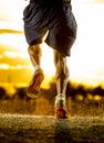 Young man strong legs off trail running at amazing summer sunset in sport and healthy lifestyle