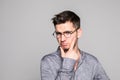 Young man Student man thinking isolated on gray background