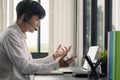 Young man student wear wireless headphone study online. She learn language listen lecture watch webinar write notes look Royalty Free Stock Photo