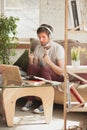 Young man studying at home during online courses for programmer, bug-tester, consulter