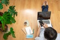 Young man studying is working at home with his mobile phone and laptop. Concept of work at home and new technologies.Safe Royalty Free Stock Photo