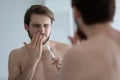 Young man suffer from gums inflammation brushing teeth Royalty Free Stock Photo