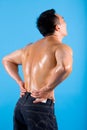 Young man suffering from back pain. Royalty Free Stock Photo