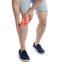 Young man suffering from knee pain on background, closeup Royalty Free Stock Photo