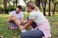 Young man suffering on the knee while walking in the park Royalty Free Stock Photo