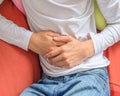 Young man suffering from stomach ache, diarrhea, constipation, acid reflux, indigestion, nausea Royalty Free Stock Photo