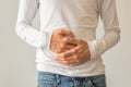 Young man suffering from stomach ache diarrhea, constipation, acid reflux, indigestion, nausea Royalty Free Stock Photo