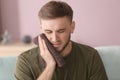 Young man suffering from toothache at home Royalty Free Stock Photo