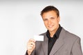 Young man in suit with business card Royalty Free Stock Photo