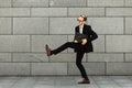 Young man in suit with folder is jumping to new job. Unlimited happiness and joy Royalty Free Stock Photo