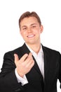 Young man in suit gesture hand forward