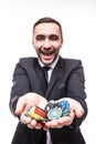 Young man in suit holding up win poker chips at game. Win poker Royalty Free Stock Photo