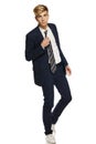 Young man in suit walking Royalty Free Stock Photo