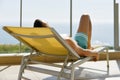 Young man sun tanning in a sunlounger Royalty Free Stock Photo