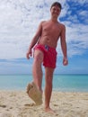 Young man sunbathing on the beach in the Caribbean sea Royalty Free Stock Photo