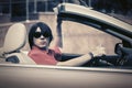 Young man in sunglasses driving convertible car Royalty Free Stock Photo