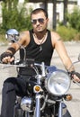 Young man with sunglasses on a motorcycle Royalty Free Stock Photo