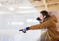 Young man supporting hockey game on skating rink Royalty Free Stock Photo