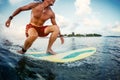 Young man surfer rides the ocean wave Royalty Free Stock Photo