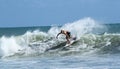 Young man surfing in Kuta