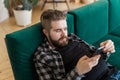 Young man surfing on social networking site using smartphone. Technologies and internet concept. Royalty Free Stock Photo