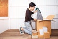Young man surprised opening box and looking inside and unpacking the package received online shopping parcel opening boxes buying Royalty Free Stock Photo